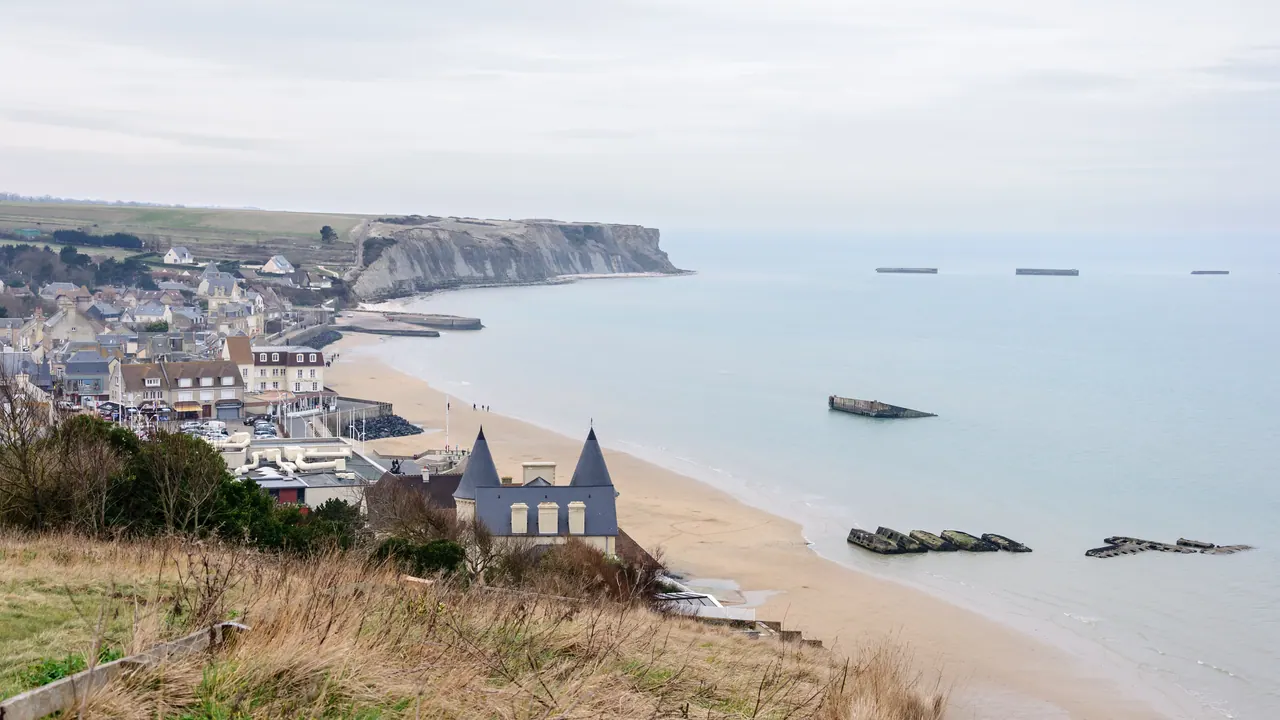 Arromanches-les-Bains seafront with remains of the Mulberry harbour caissons offshore