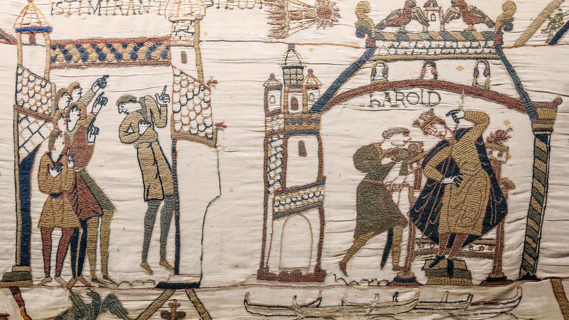Bayeux Tapestry section showing men watching Halley's Comet and Harold seated at Westminster