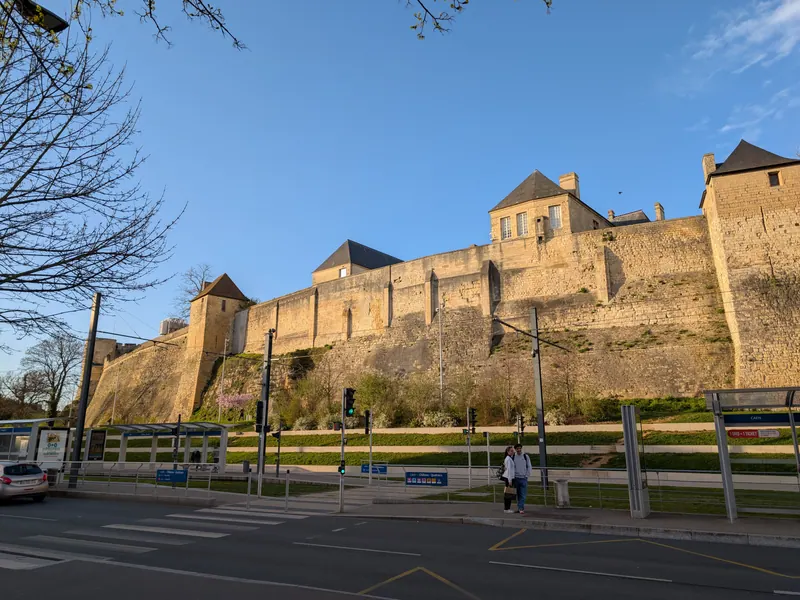 Stone ramparts of the Château de Caen seen from the south