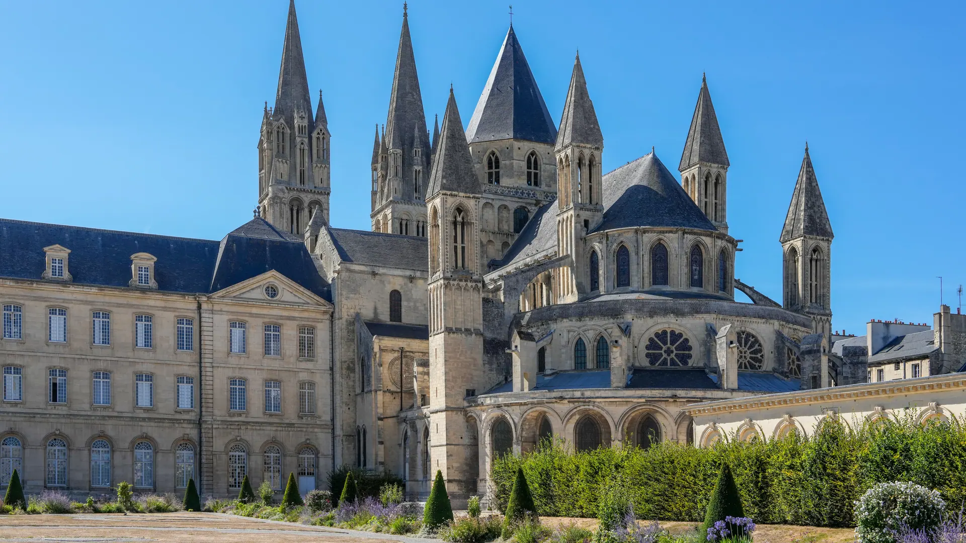 Abbaye aux Hommes in Caen with its church spires behind the town hall