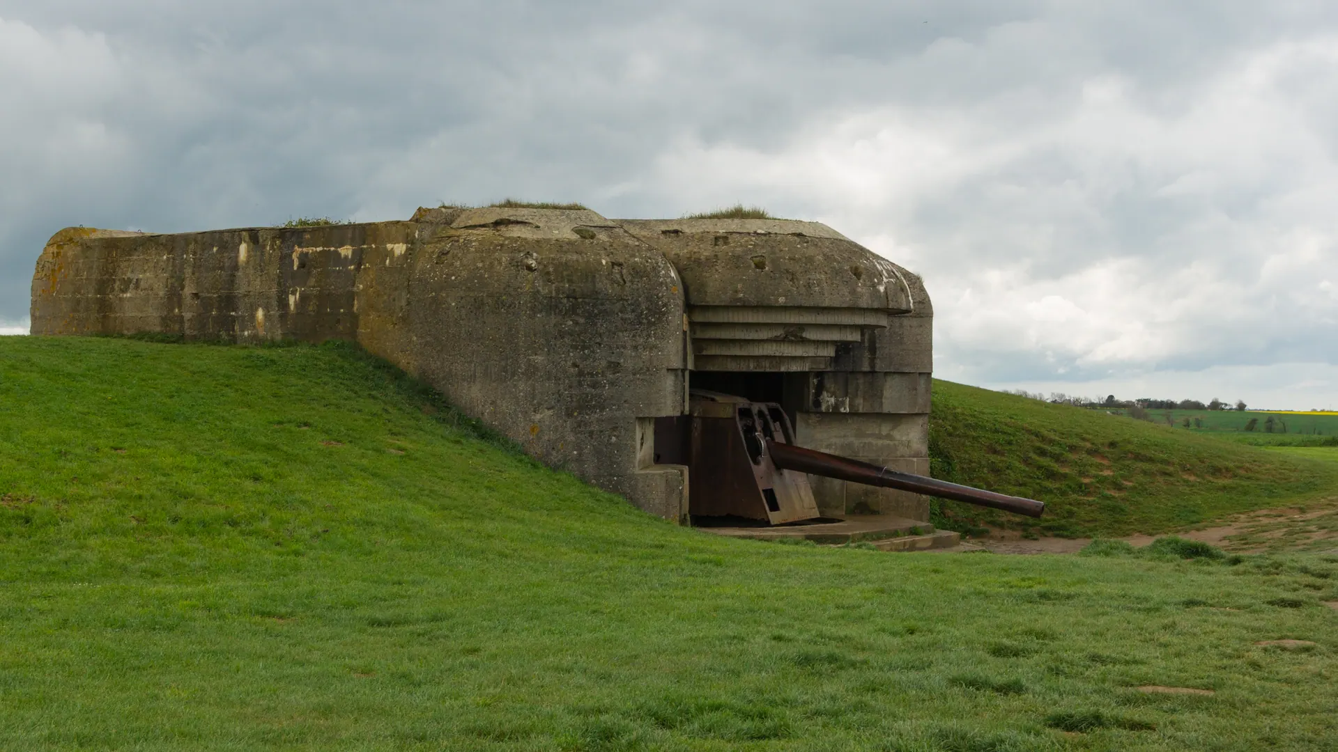 German gun casemate of the Longues-sur-Mer battery on a grassy clifftop