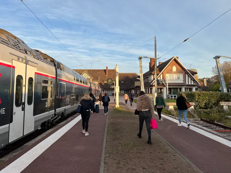 Regional train at the platform of Trouville-Deauville station with travellers