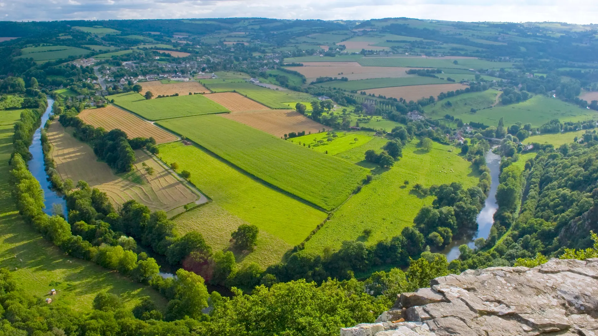 Patchwork fields and a loop of the Orne river in the Suisse Normande