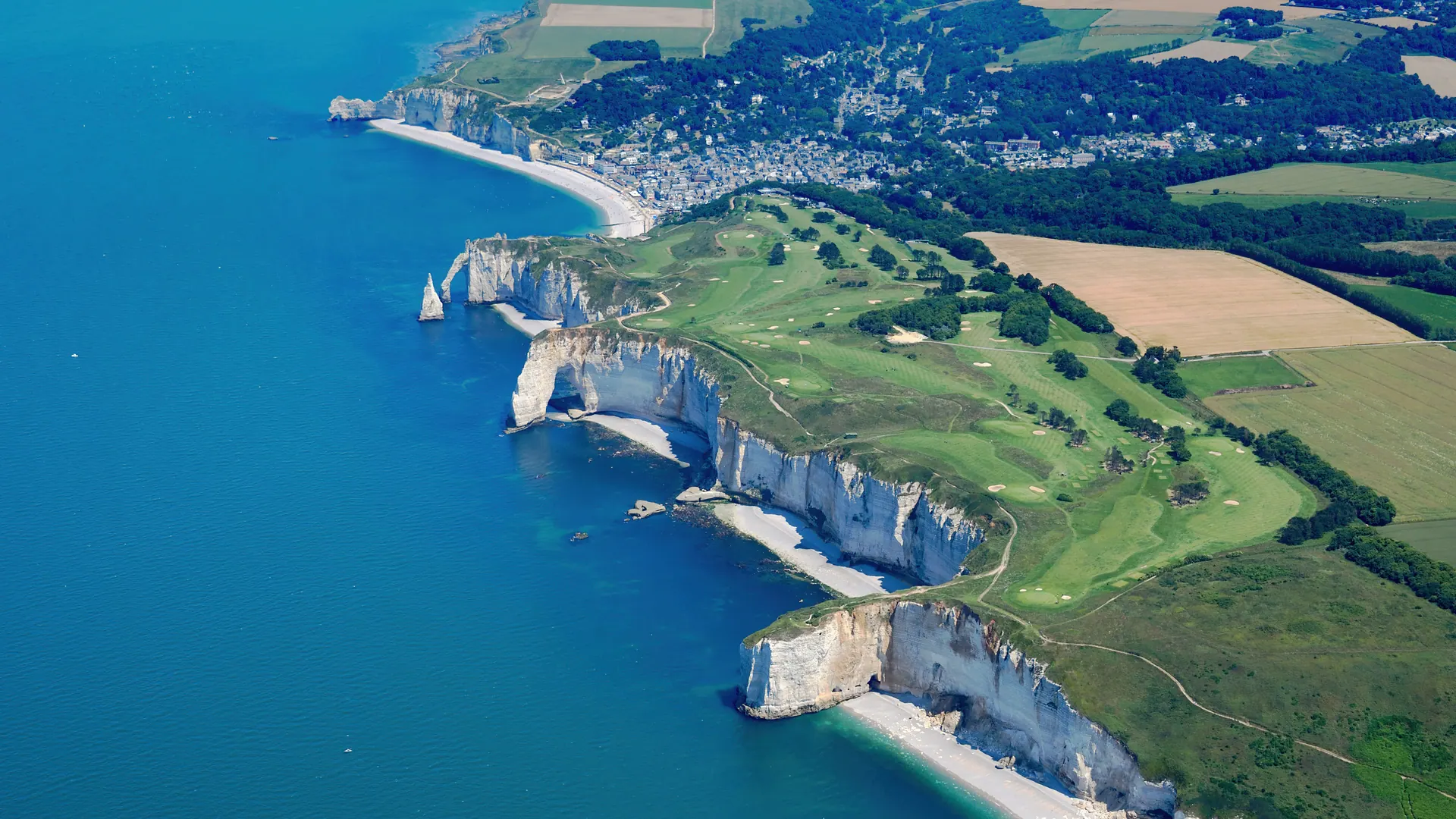 Aerial view of the Étretat cliffs, town and coastline of the Pays de Caux