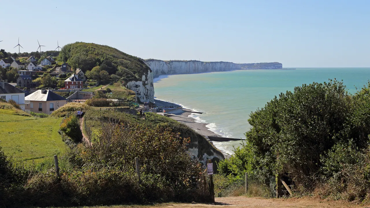 Coastal view of chalk cliffs, beach and village houses near Veules-les-Roses