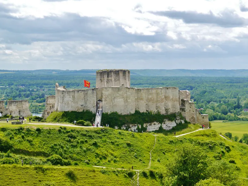 Ruined keep and walls of Château Gaillard on a grassy hilltop