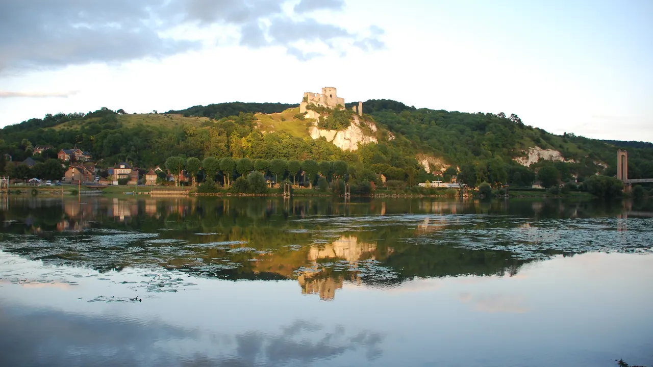 Château Gaillard ruins on a wooded hill reflected in the Seine at Les Andelys