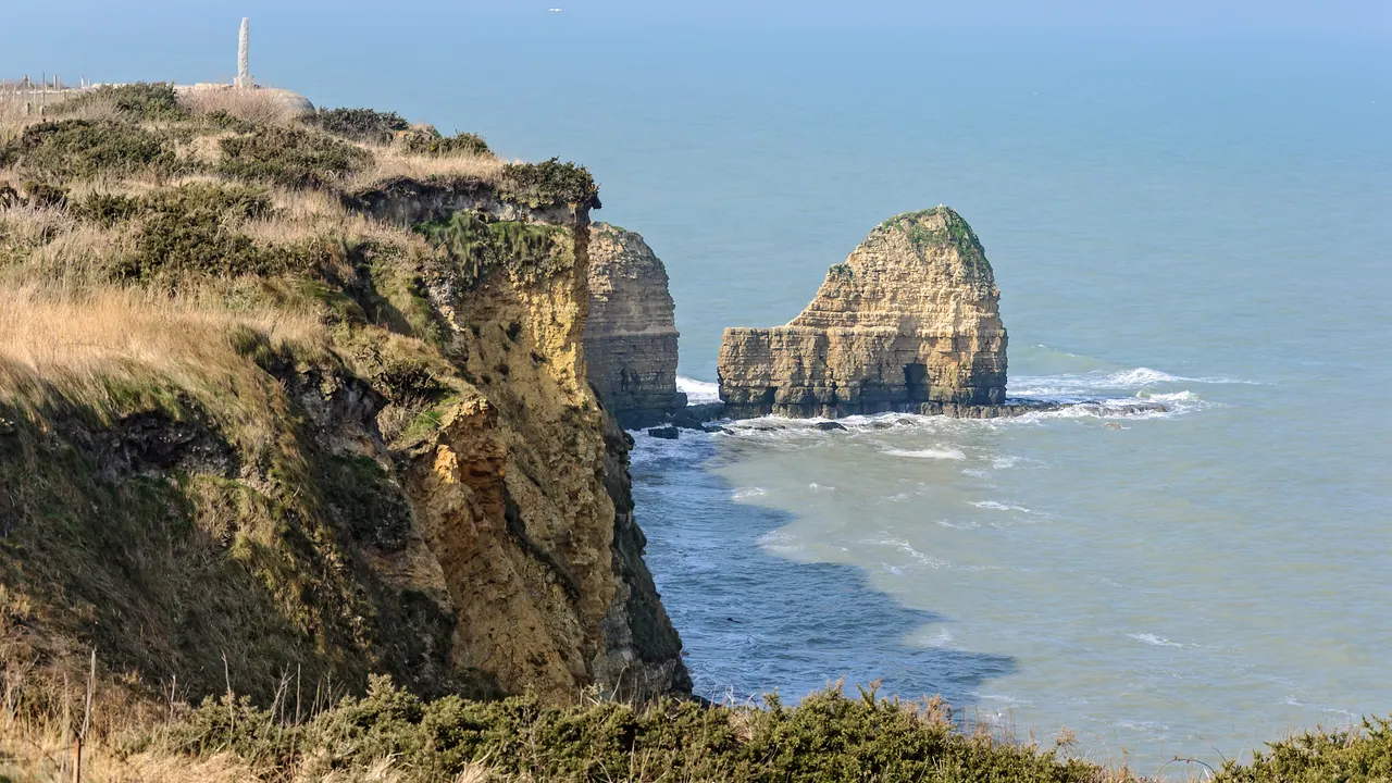 Cliffs and rock stacks at Pointe du Hoc rising above the English Channel