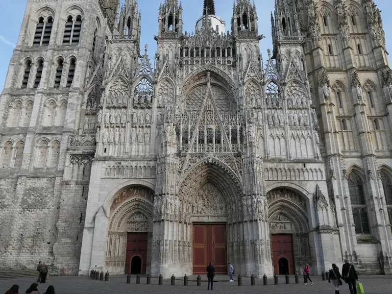 Gothic west front of Rouen Cathedral with its three carved portals