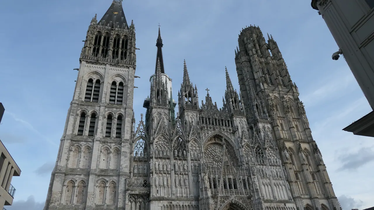 West facade of Rouen Cathedral with its Gothic portals and two towers