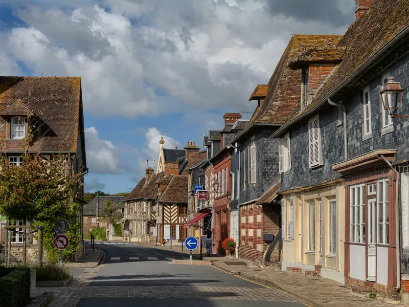 Half-timbered houses lining the main street of Beuvron-en-Auge